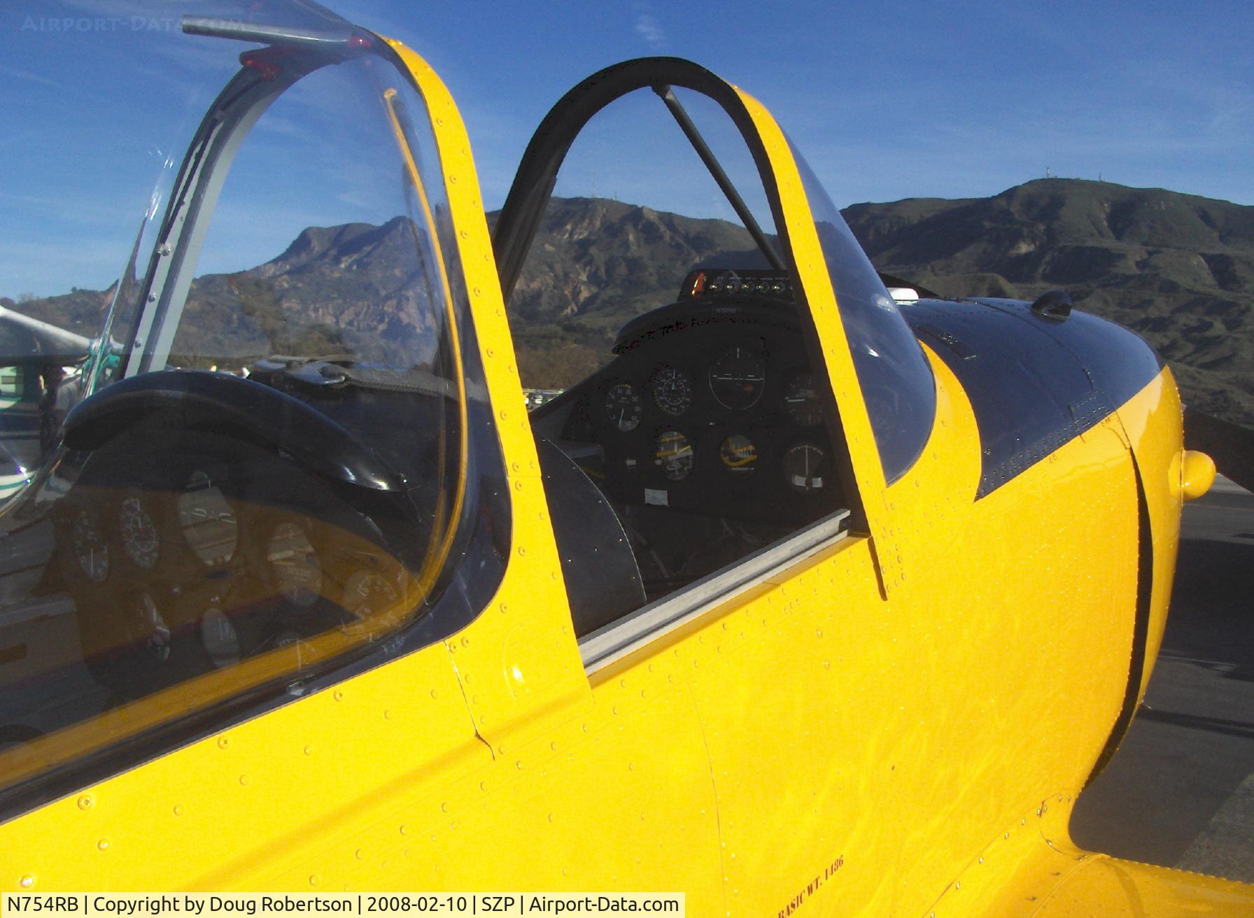 N754RB, 1952 De Havilland DHC-1 Chipmunk T.10 C/N C1/0532, 1952 DeHavilland DHC-1 CHIPMUNK 145 Hp Bristol-Siddeley (D.H.) Gipsy Major 8, front & rear panels, this aircraft shown in flight in July 2008 Aviation Legends calendar