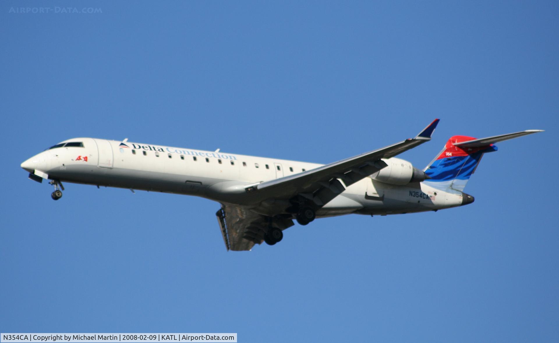 N354CA, 2002 Bombardier CRJ-701ER (CL-600-2C10) Regional Jet C/N 10064, On final for Runway 26R