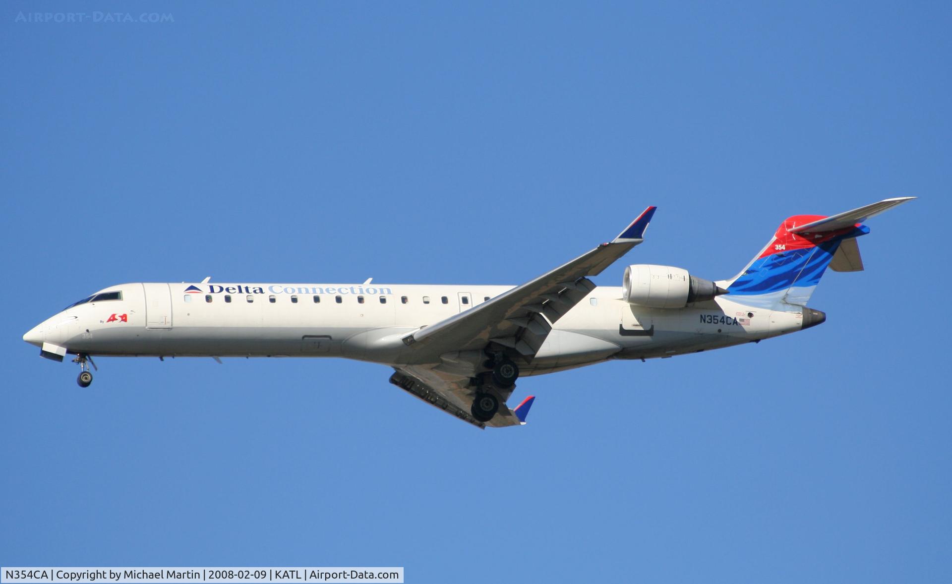 N354CA, 2002 Bombardier CRJ-701ER (CL-600-2C10) Regional Jet C/N 10064, On final for Runway 26R