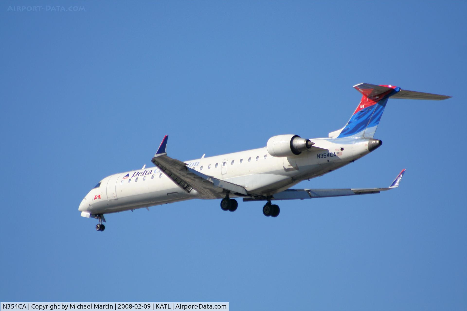 N354CA, 2002 Bombardier CRJ-701ER (CL-600-2C10) Regional Jet C/N 10064, Short Final for 26R