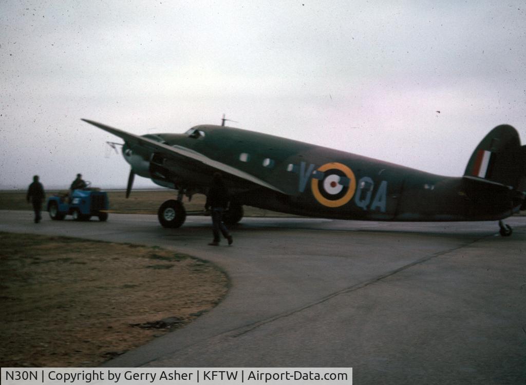 N30N, 1942 Lockheed 18-50 Lodestar C/N 18-2274, 30N's first military paint scheme after purchase by the Confederate Air Force. Seen here being towed from its Meacham Field hangar for an engine run, March 1975.