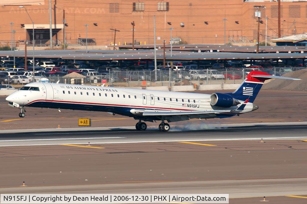 N915FJ, 2004 Bombardier CRJ900 (CL-600-2D24) C/N 15015, US Airways Express (operated by Mesa Airlines) N915FJ (FLT ASH2933) from Bakersfield Meadows Field (KBFL) landing on RWY 26.