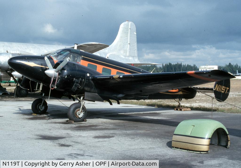 N119T, 1960 Beech G18S C/N BA-488, One of a number of twin Beeches at Opa Locka during the summer of '80. Cowling in foreground was from another Beech next door, N205A.