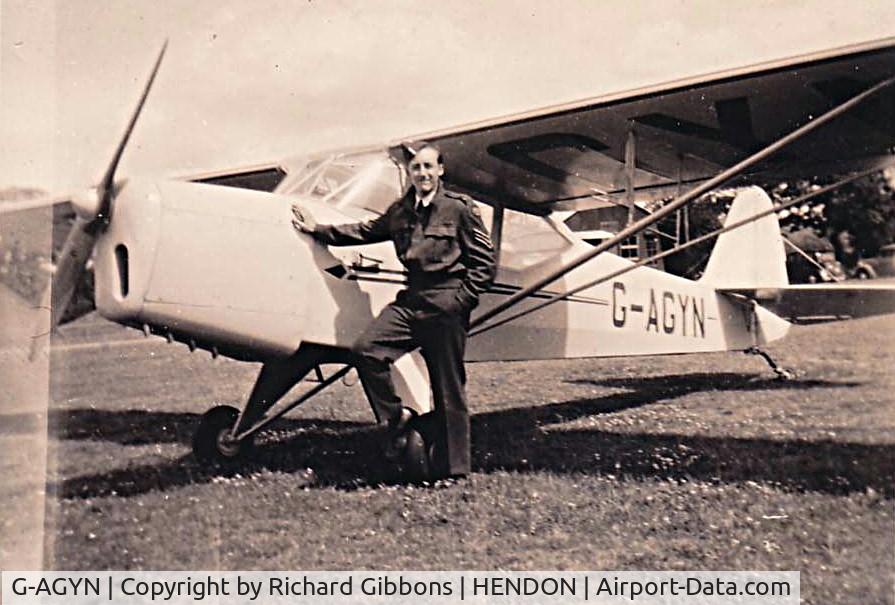 G-AGYN, Auster J-1 Autocrat C/N 2005, Parked, with ATC Cadet hand on.