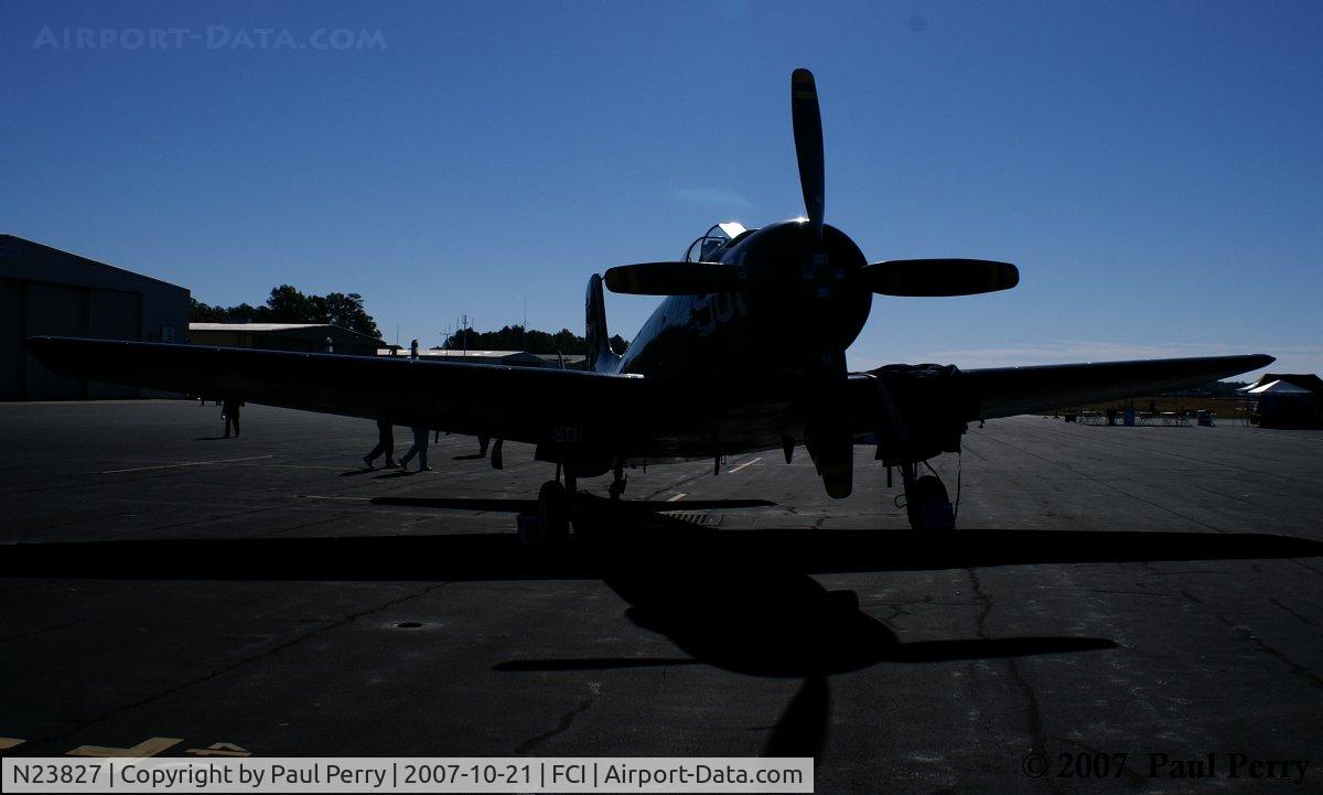 N23827, 1949 Douglas AD-4 C/N 7133, Crowds disappearing, and with her in near-silhouette..she looks massive
