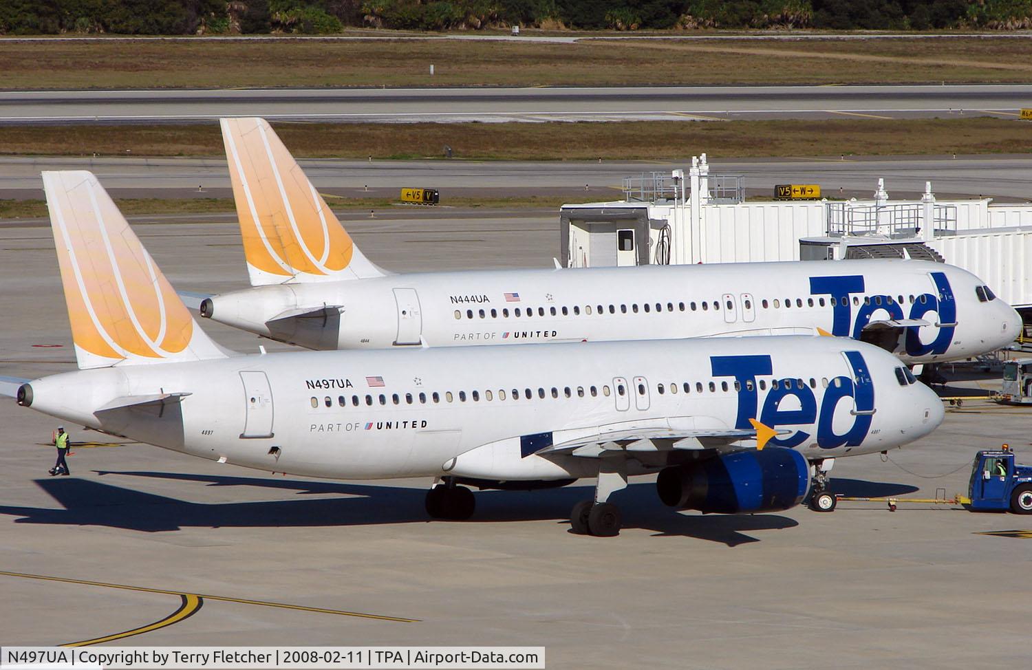 N497UA, 2002 Airbus A320-232 C/N 1847, A pair of TED A320s on stand at Tampa