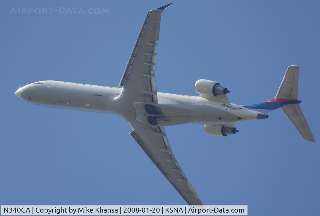 N340CA, 2002 Bombardier CRJ-701ER (CL-600-2C10) Regional Jet C/N 10062, BOmbardier CL-600-2B16 blasting off into the blue sky.
