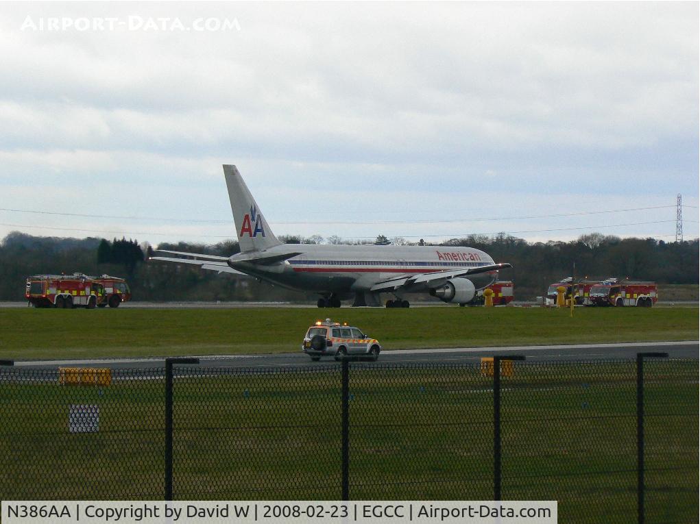 N386AA, 1994 Boeing 767-323/ER C/N 27060, American Airlines flight 55 returning back to Manchester an hour into it's flight to Chicago due to hydraulic failure. Note the main landing gear doors hanging down.