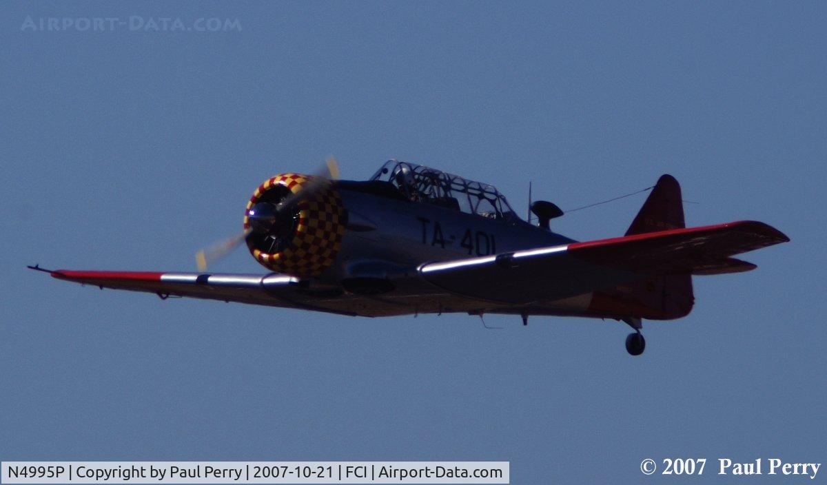 N4995P, 1951 North American T-6G Texan C/N 168-525, Cruising toward show center