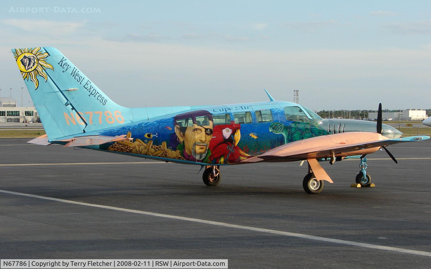 N67786, 1981 Cessna 402C Utiliner C/N 402C0631, Must be one of the most colourful schemes on a Cessna 402