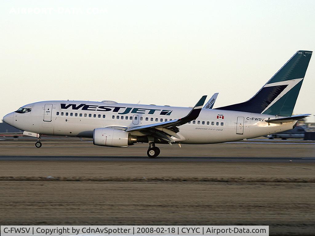 C-FWSV, 2003 Boeing 737-7CT C/N 32760, One inch left before touch down on Rwy 34