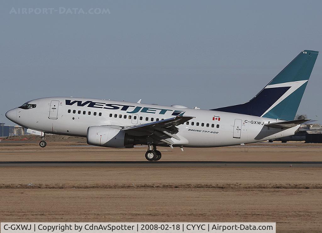 C-GXWJ, 2006 Boeing 737-6CT C/N 35570, Inches from touching down on Rwy 34