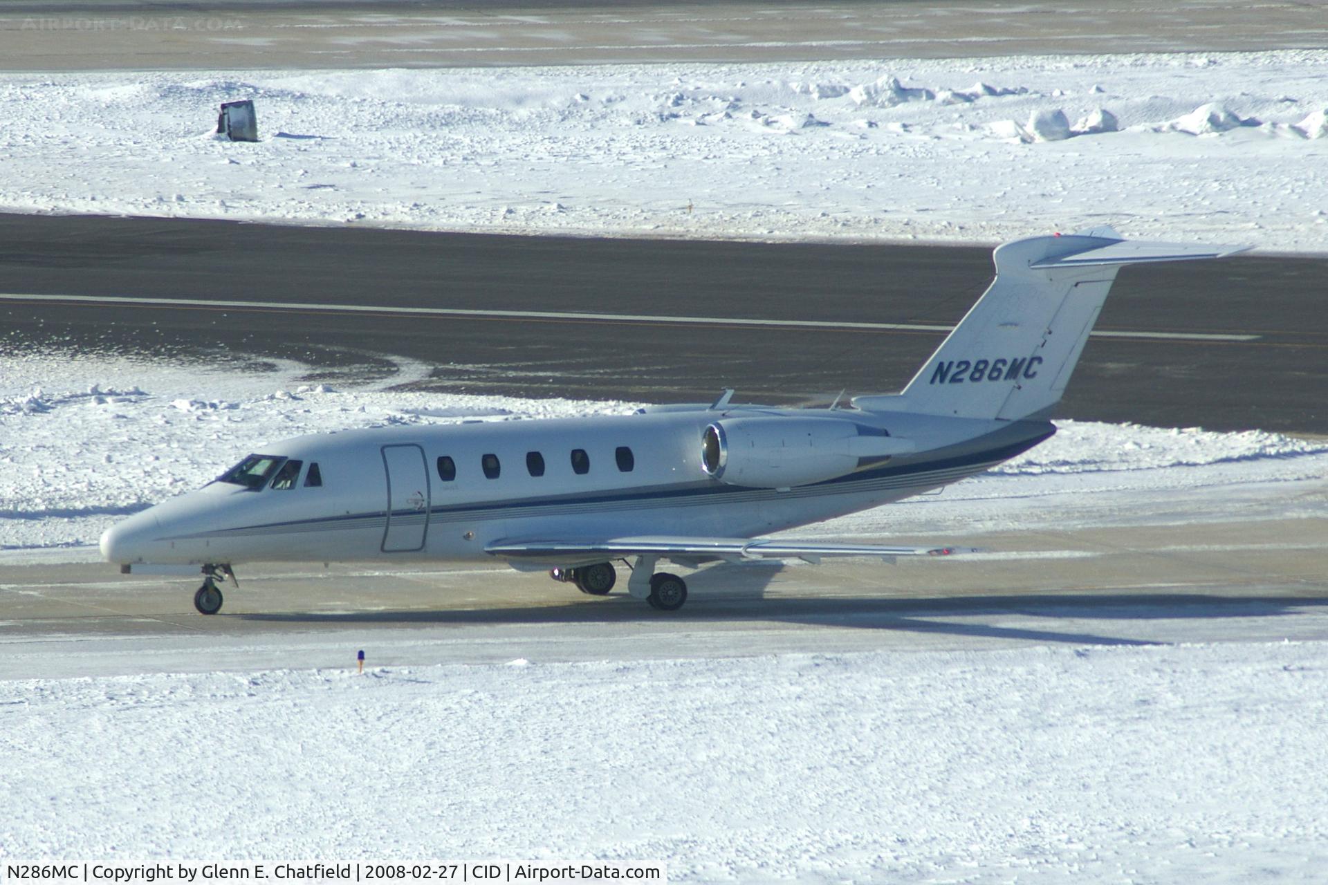 N286MC, 1997 Cessna 650 C/N 650-7076, Long-distance shot into the sun, just crossed Runway 13/31 on Alpha