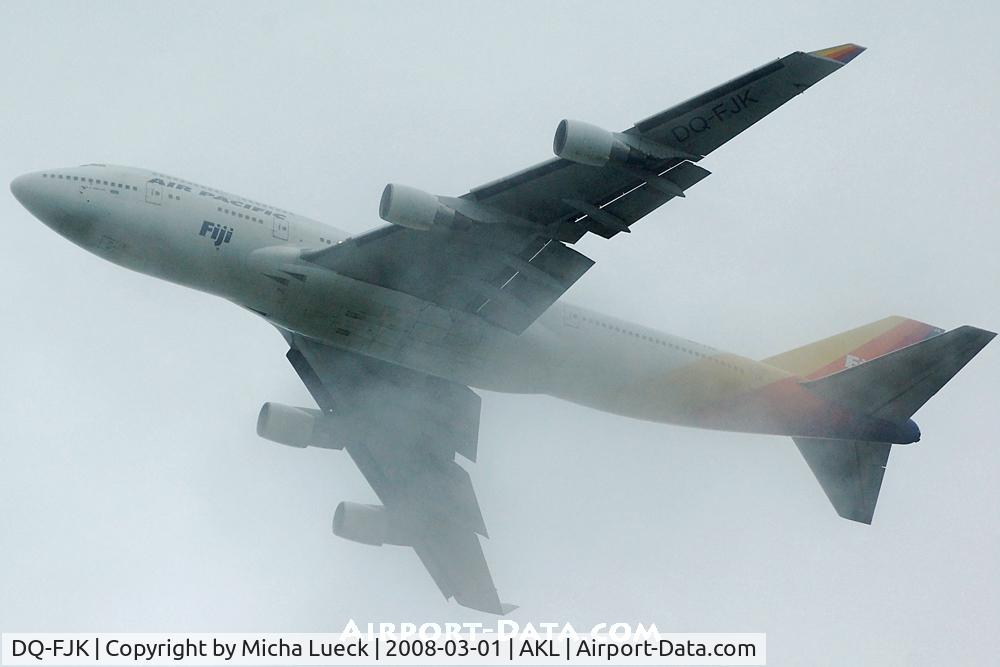 DQ-FJK, 1989 Boeing 747-412 C/N 24064, Disappearing in the rain clouds...