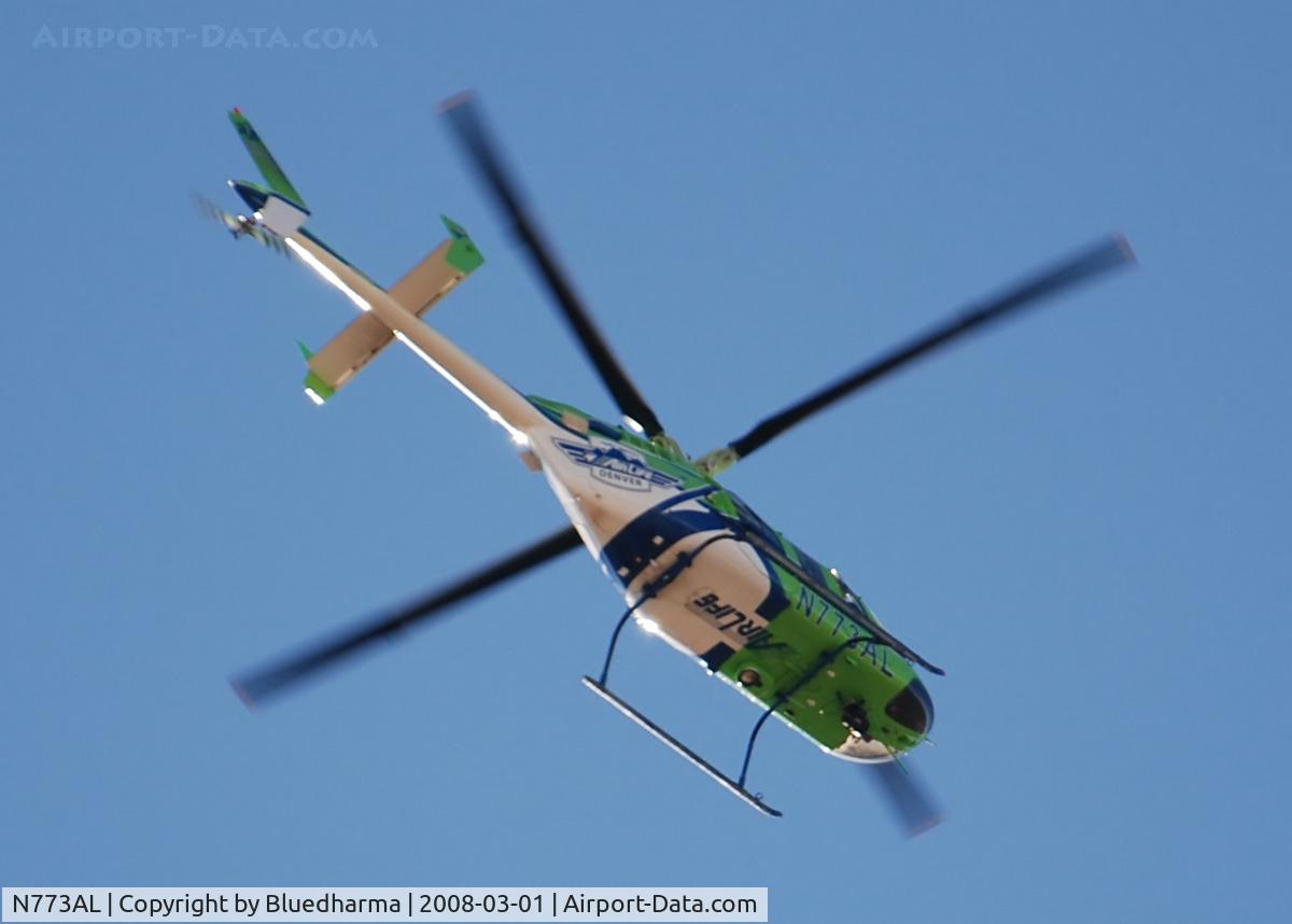 N773AL, 1997 Bell 407 C/N 53160, AirLife Denver heading west over Columbine High School.