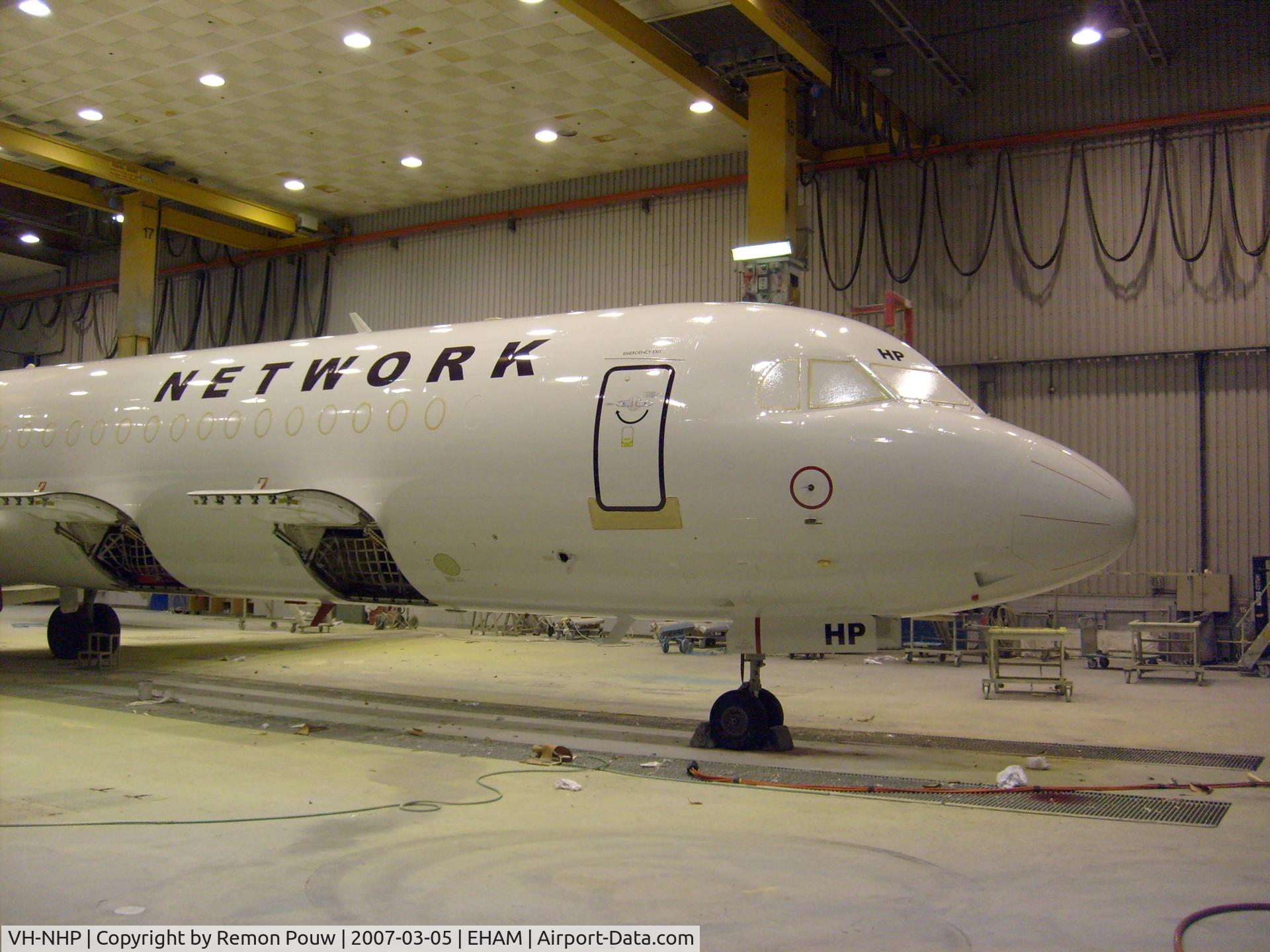 VH-NHP, 1992 Fokker 100 (F-28-0100) C/N 11399, First jet powered aircraft for Network Aviation. Seen here inside the QAPS painting hangar at Schiphol, approx. 8 hours before it rolled out. (Ex Air Berlin D-AGPS)