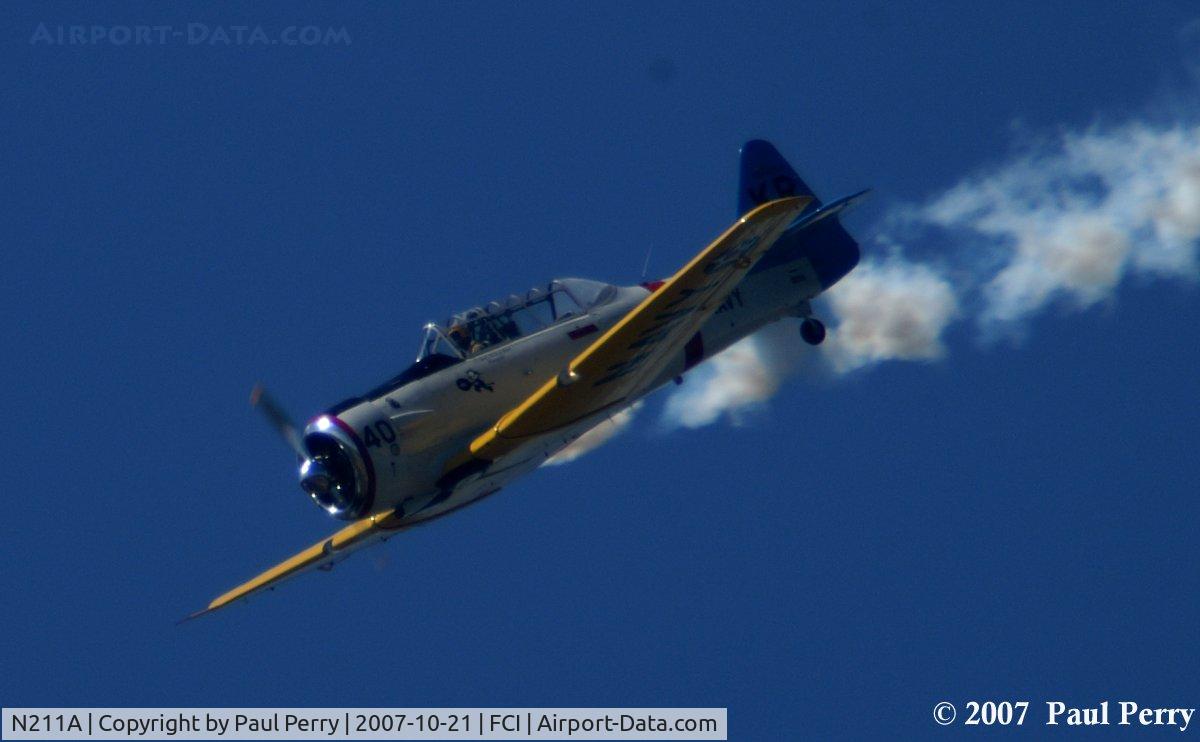 N211A, 1958 North American SNJ-6 Texan C/N 121-42318, Inbound and smoking