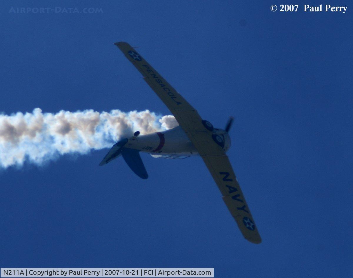 N211A, 1958 North American SNJ-6 Texan C/N 121-42318, Rolling out, keeping the smoke rolling too
