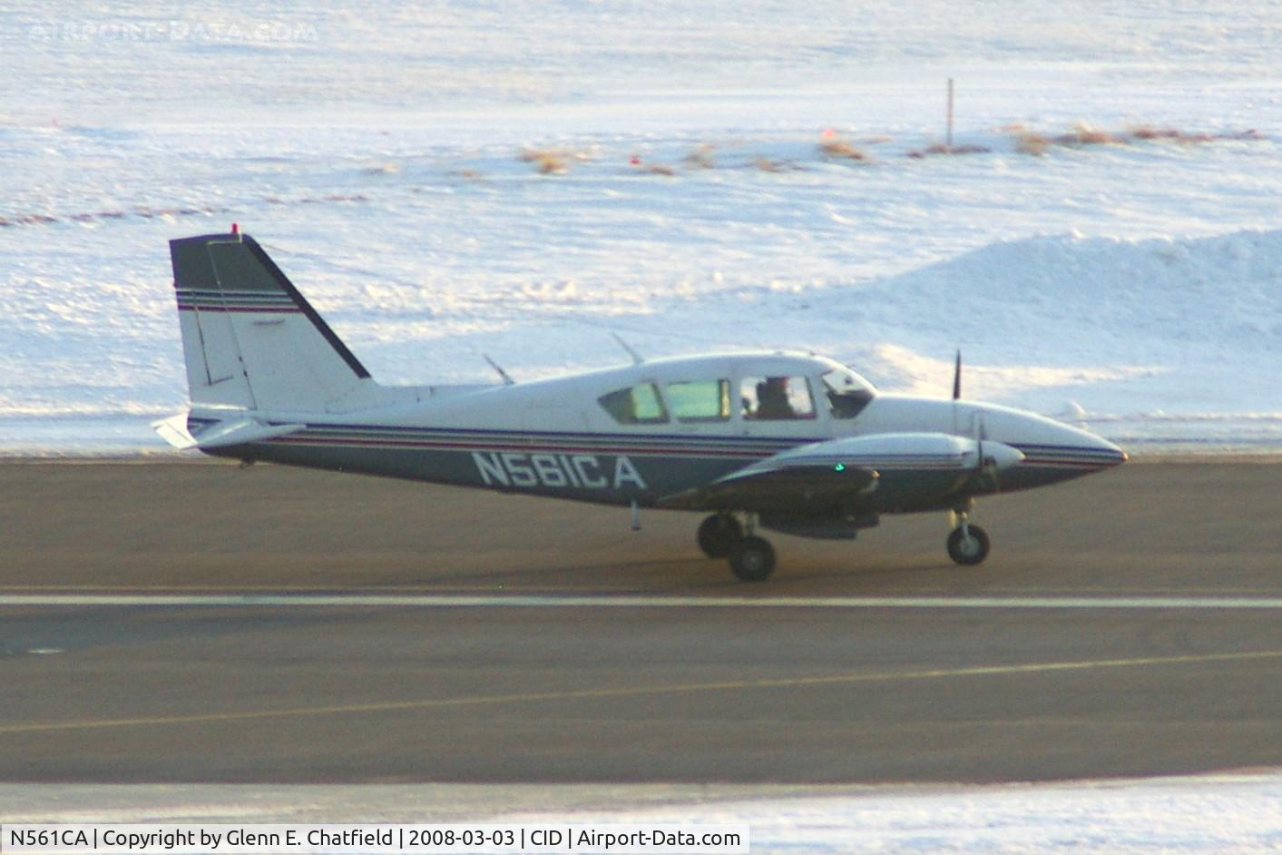 N561CA, 1976 Piper PA-23-250 Aztec C/N 27-7754005, Rolling out on Runway 31, starting to turn left onto Alpha taxiway, at sunset.