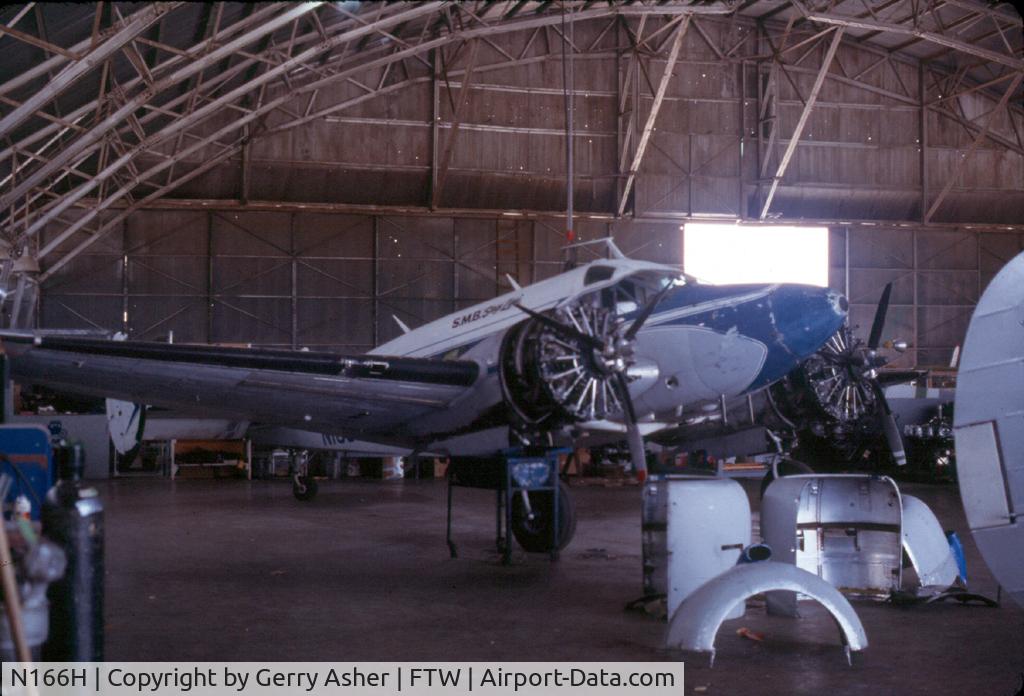 N166H, 1957 Beech E18S C/N BA-253, Taken inside SMB's maintenance hangar on the south end of Meacham Field - now occupied by the Vintage Flight Museum and the B-17G 