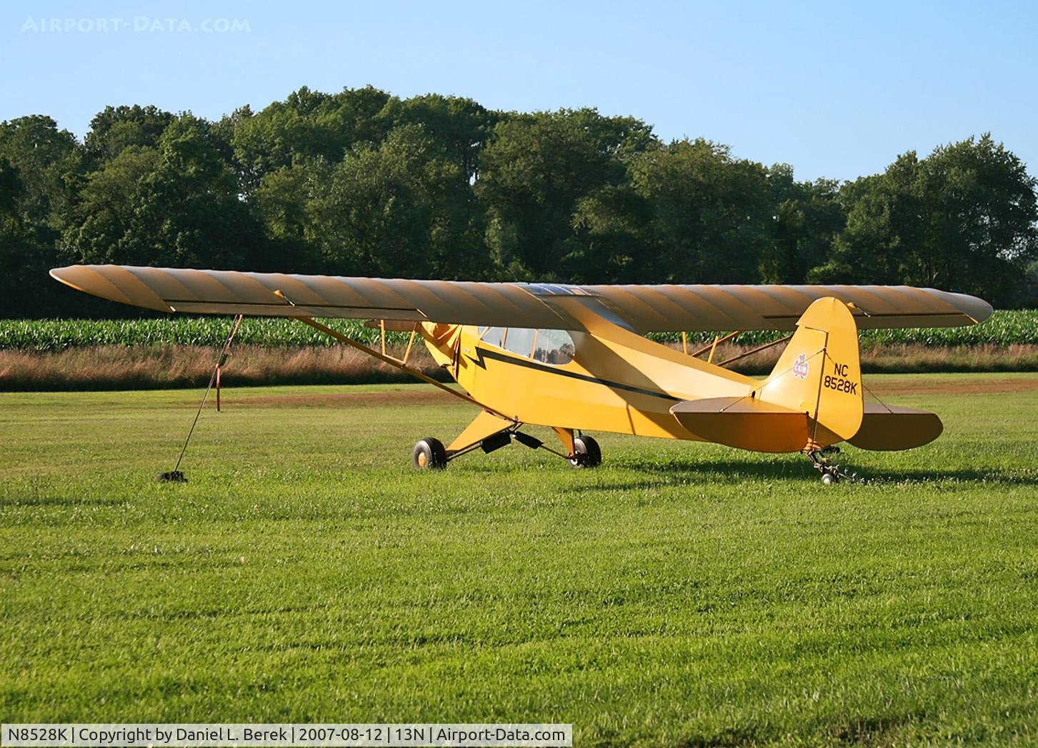 N8528K, Piper J3C-65 Cub C/N 19375, A lovely, sunny bright yellow cub enjoys the rural sunshine at this little airport.