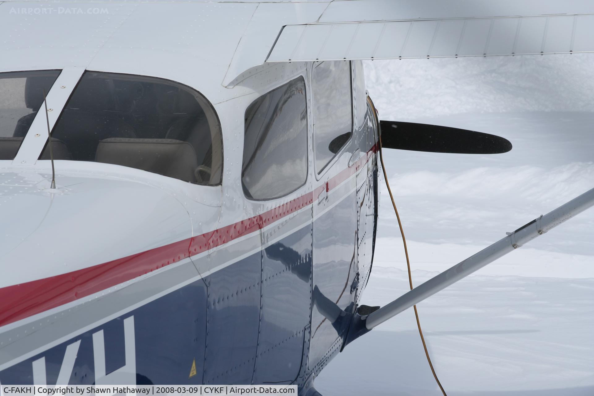 C-FAKH, 1998 Cessna 172S C/N 172S8008, Parked at Waterloo Airport after heavy snow fall.