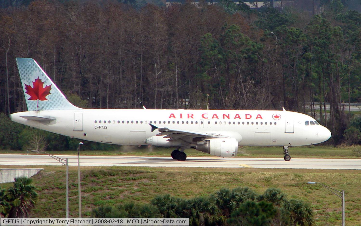C-FTJS, 1991 Airbus A320-211 C/N 253, Air Canada A320 taxies over the inter-terminal connecting bridge at Orlando Int