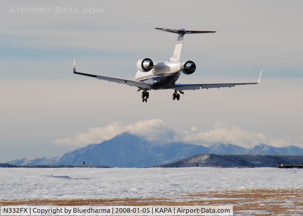 N332FX, 2002 Bombardier Challenger 604 (CL-600-2B16) C/N 5543, Approach to 17L with Pikes Peak in the background.