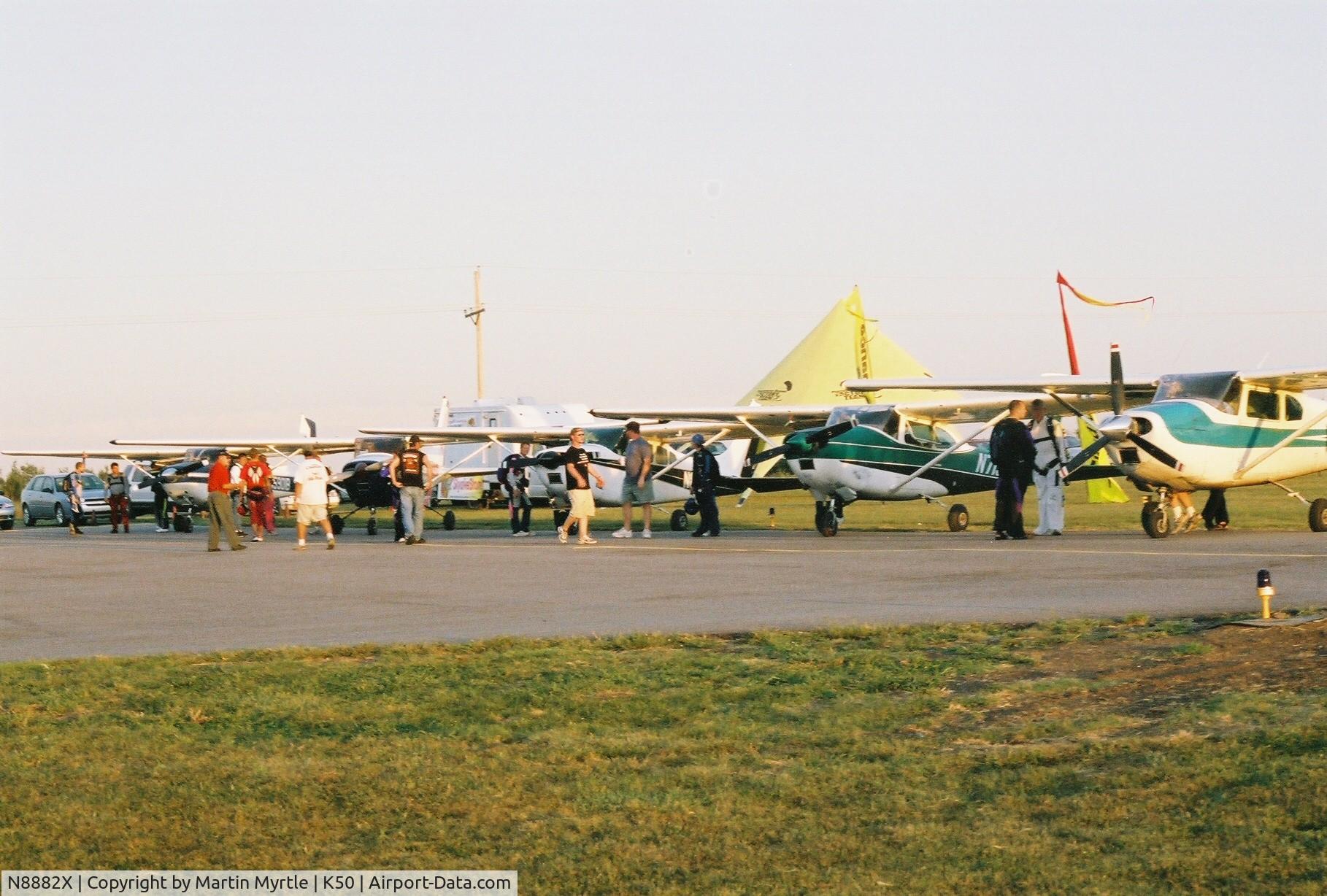 N8882X, 1961 Cessna 182D Skylane C/N 18253282, N8882X in the middle of this line up.  5 182 formation skydiving load.