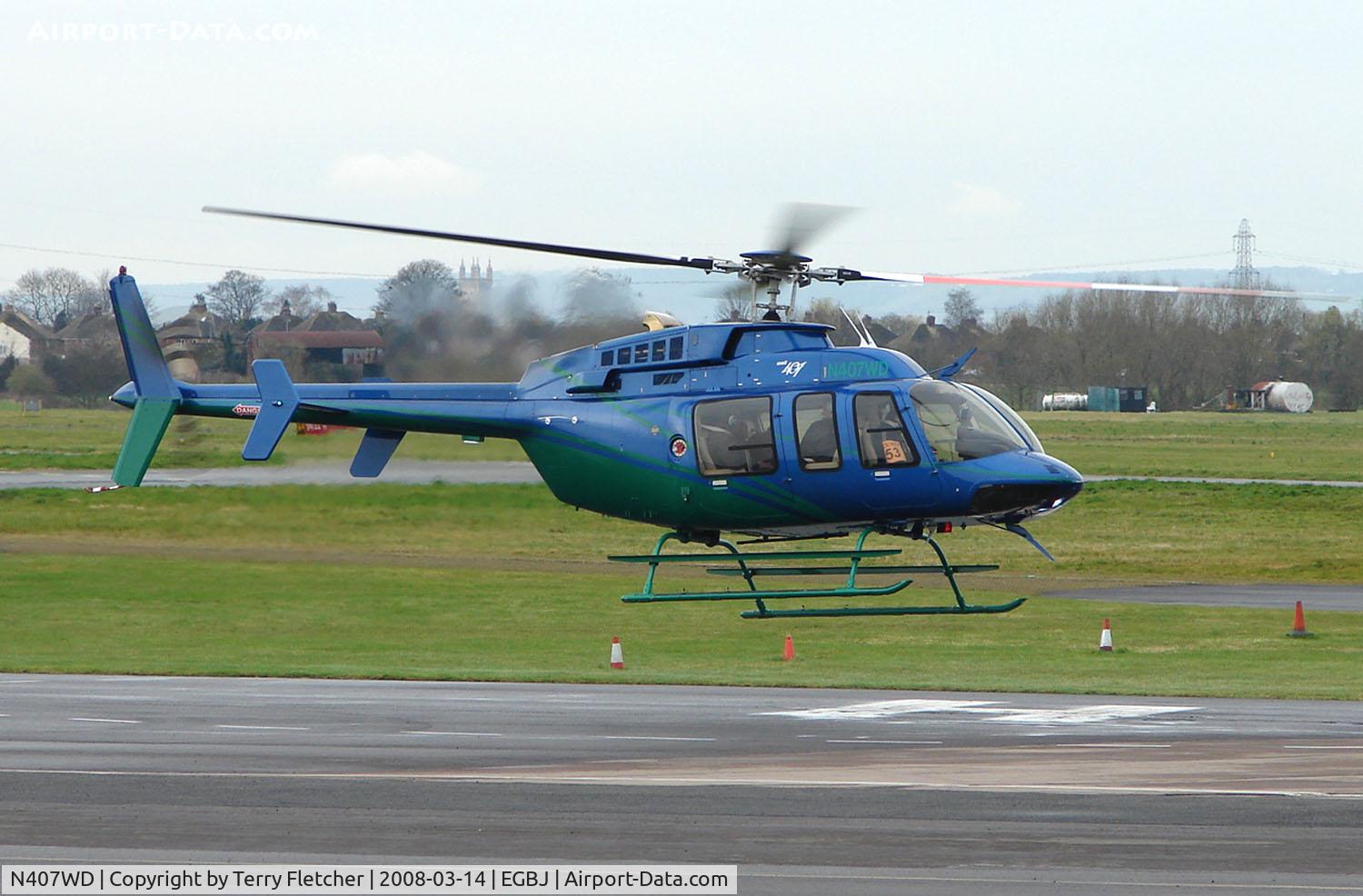 N407WD, 2006 Bell 407 C/N 53694, A visitor to Gloucestershire Airport on the day of the horse racing Gold Cup  at the nearby Cheltenham Racecourse