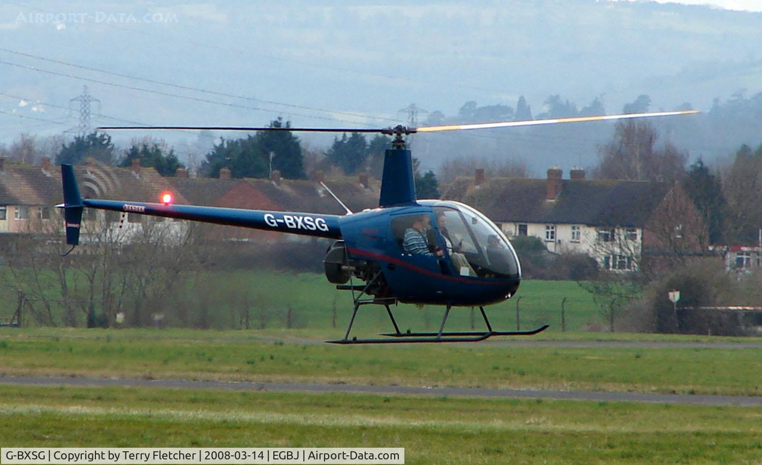 G-BXSG, 1998 Robinson R22 Beta C/N 2789, A visitor to Gloucestershire Airport on the day of the horse racing Gold Cup  at the nearby Cheltenham Racecourse