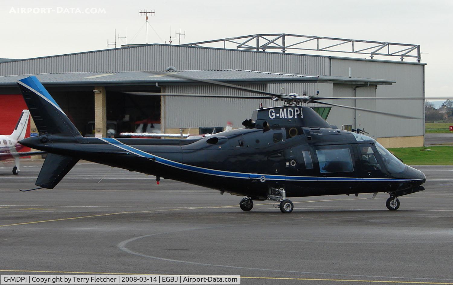 G-MDPI, 1987 Agusta A-109A-2 C/N 7393, A visitor to Gloucestershire Airport on the day of the horse racing Gold Cup  at the nearby Cheltenham Racecourse