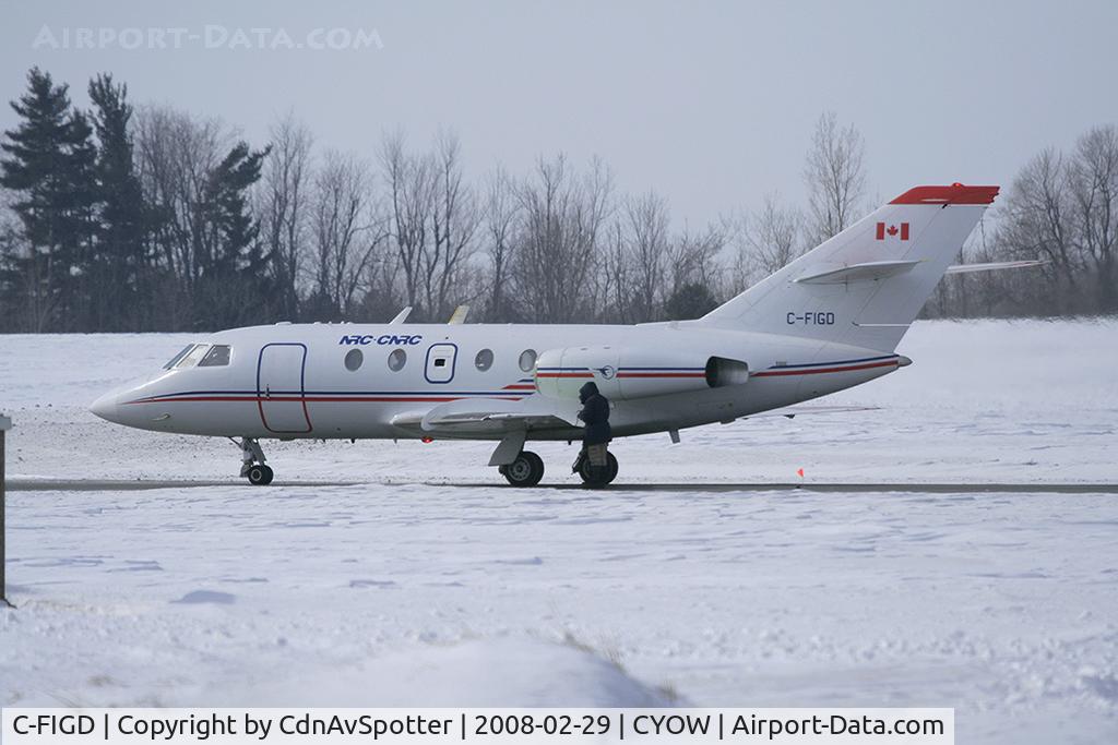 C-FIGD, 1967 Dassault Falcon (Mystere) 20C C/N 109, This Dassault Mystere belongs to the NRC and they were out testing new formulas for de-icing as you can see a bright green glow reflecting off the engine cowling