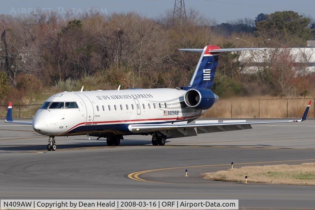 N409AW, 2000 Bombardier CRJ-200LR (CL-600-2B19) C/N 7447, US Airways Express (operated by Air Wisconsin) N409AW (FLT AWI3719) from Philadelphia Int'l (KPHL) exitting RWY 5 at Taxiway 