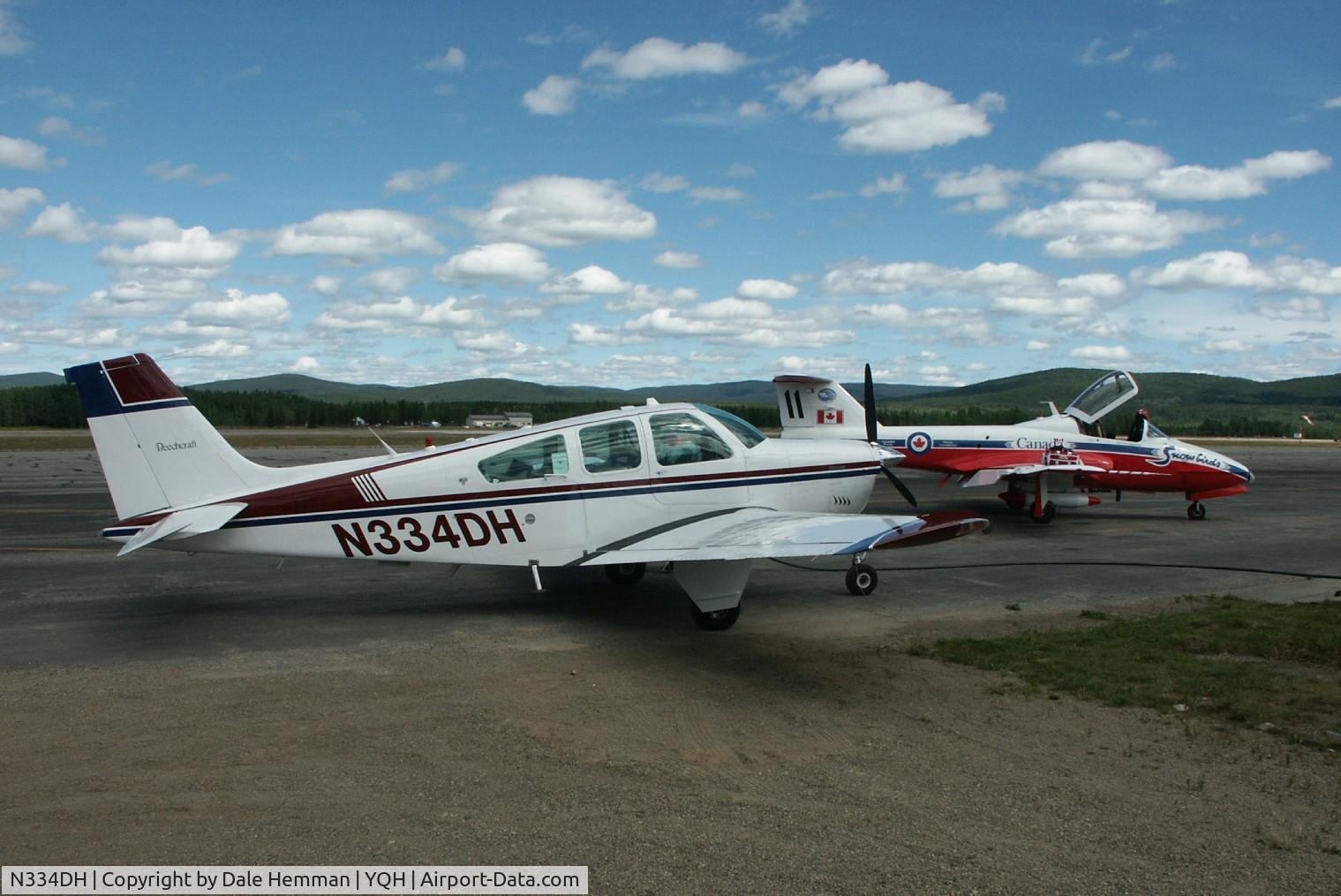 N334DH, 1975 Beech F33A Bonanza C/N CE-625, On the ramp at Watson Lake with Snowbird jet