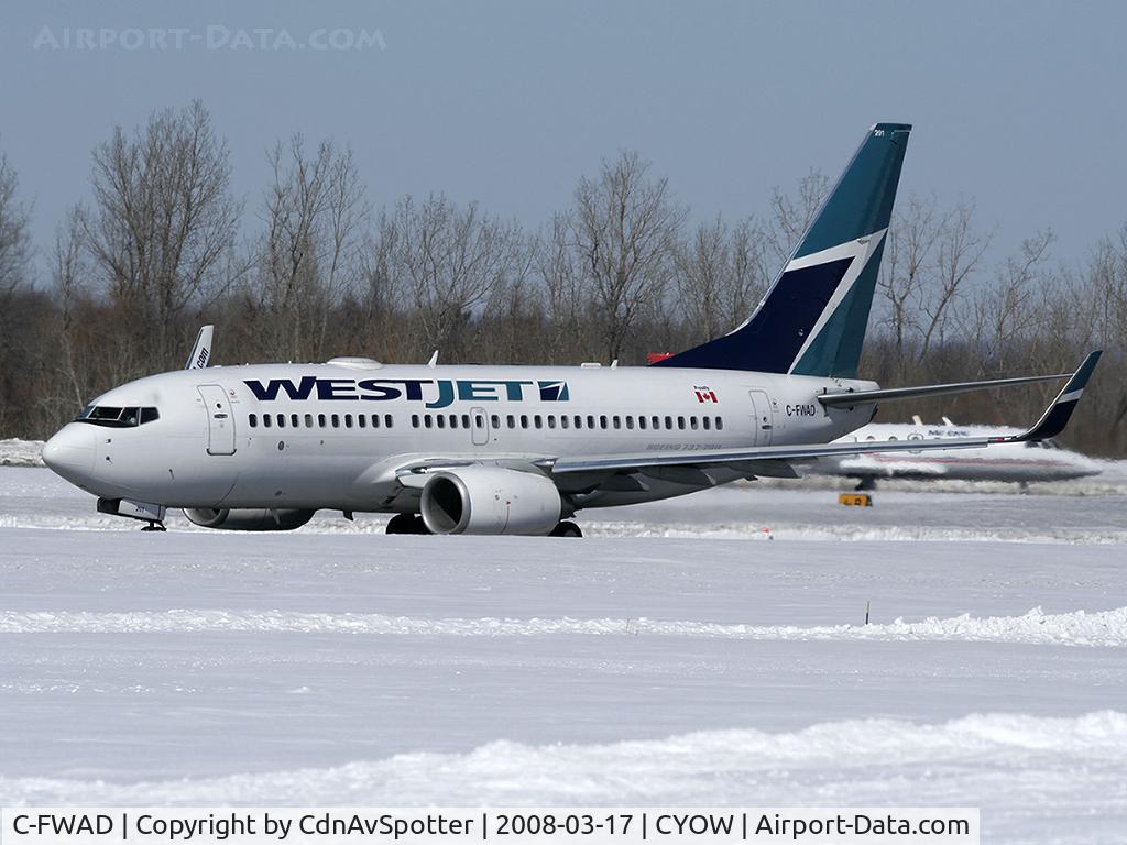 C-FWAD, 2002 Boeing 737-7CT C/N 32753, On the takeoff roll on Rwy 25