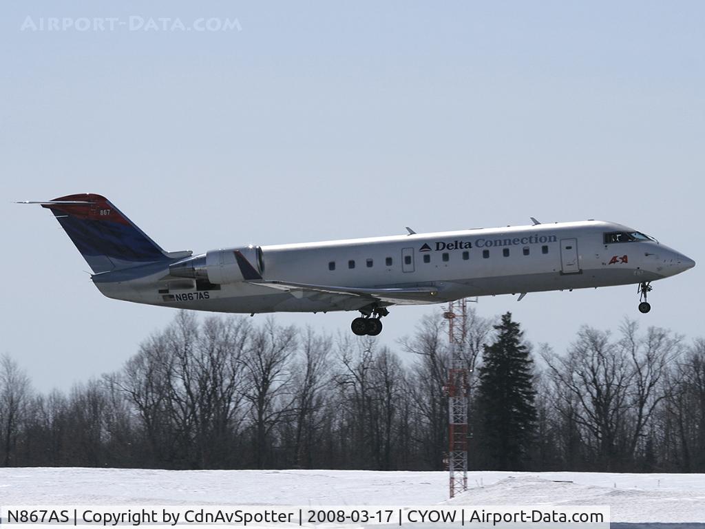 N867AS, 2000 Bombardier CRJ-200ER (CL-600-2B19) C/N 7463, After circling around YOW for 20 minutes, the pilots are unsure if the landing gear is locked and land safely on Rwy 32.  As a precuation, they requested the fire brigade to be deployed along the runway.