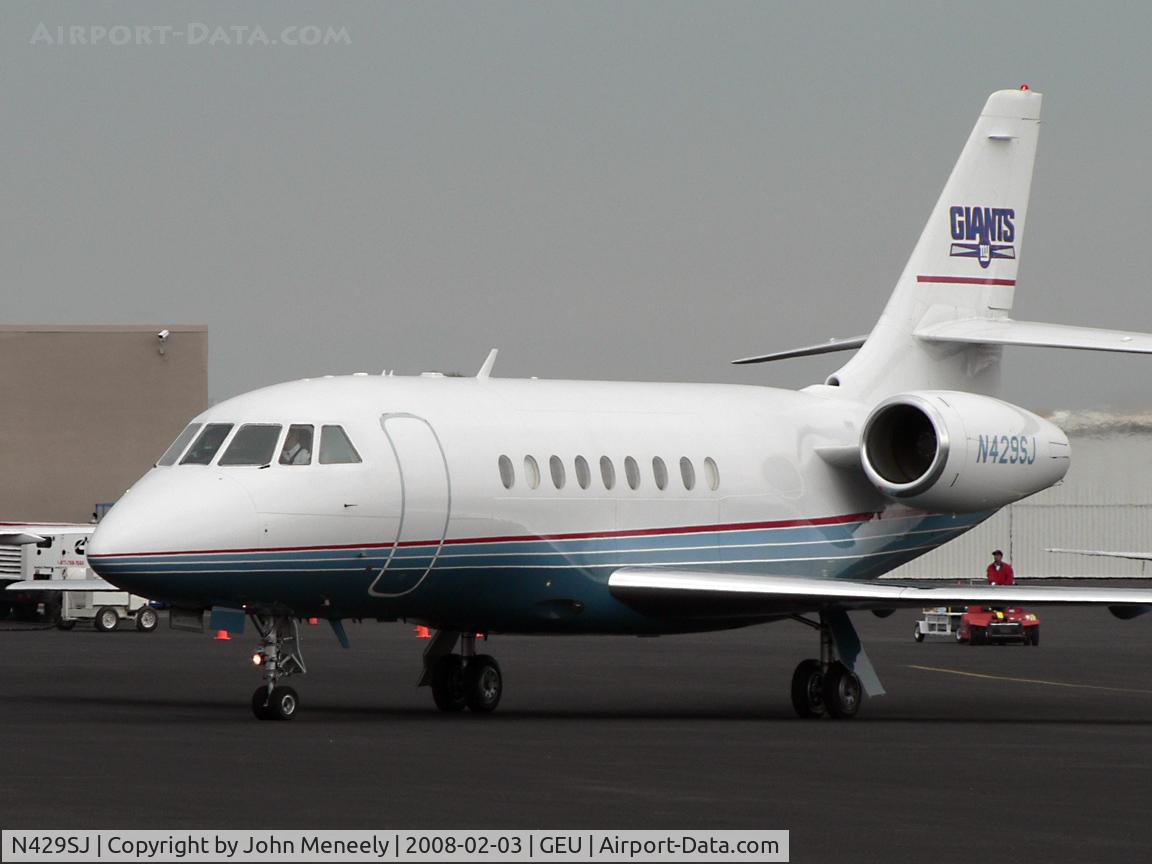 N429SJ, 1998 Dassault Falcon 2000 C/N 66, Superbowl visitor - Giants logo on fin.