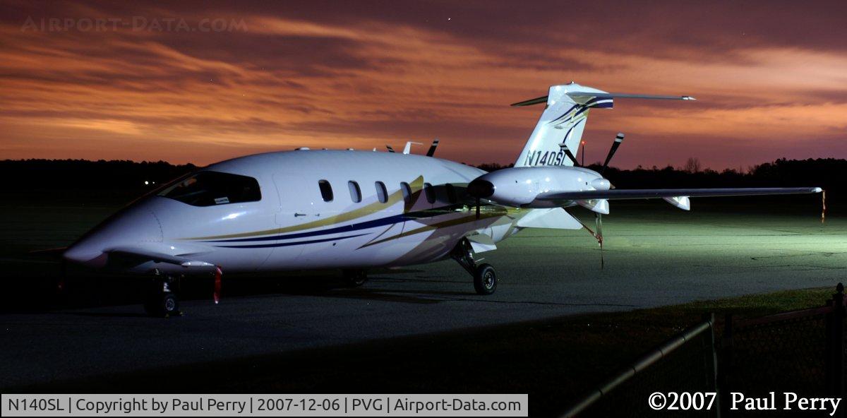 N140SL, 2005 Piaggio P-180 Avanti II C/N 1107, Looks like a sunset, but not quite.  At 23:00hrs, its the lights of the Portsmouth/Norfolk area on the clouds