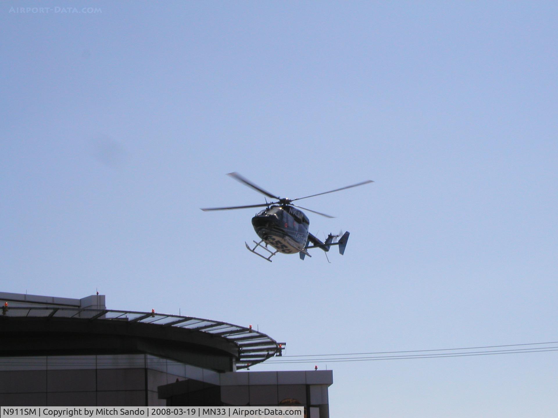 N911SM, 1998 Eurocopter-Kawasaki BK-117B-2 C/N 7253, LifeFlight landing at St. Mary's Duluth VFR from the Hayward Area Memorial Hospital in Hayward, WI.