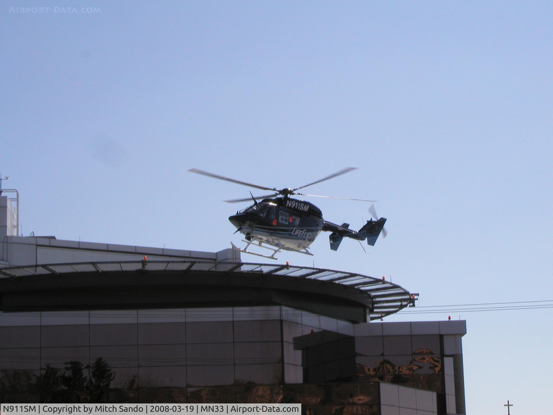 N911SM, 1998 Eurocopter-Kawasaki BK-117B-2 C/N 7253, LifeFlight landing at St. Mary's Duluth VFR from the Hayward Area Memorial Hospital in Hayward, WI.