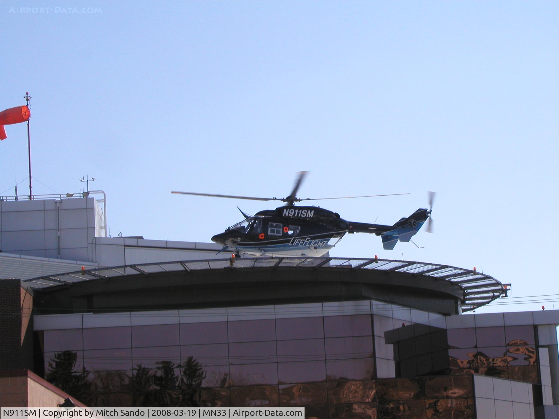 N911SM, 1998 Eurocopter-Kawasaki BK-117B-2 C/N 7253, LifeFlight landing at St. Mary's Duluth VFR from the Hayward Area Memorial Hospital in Hayward, WI.