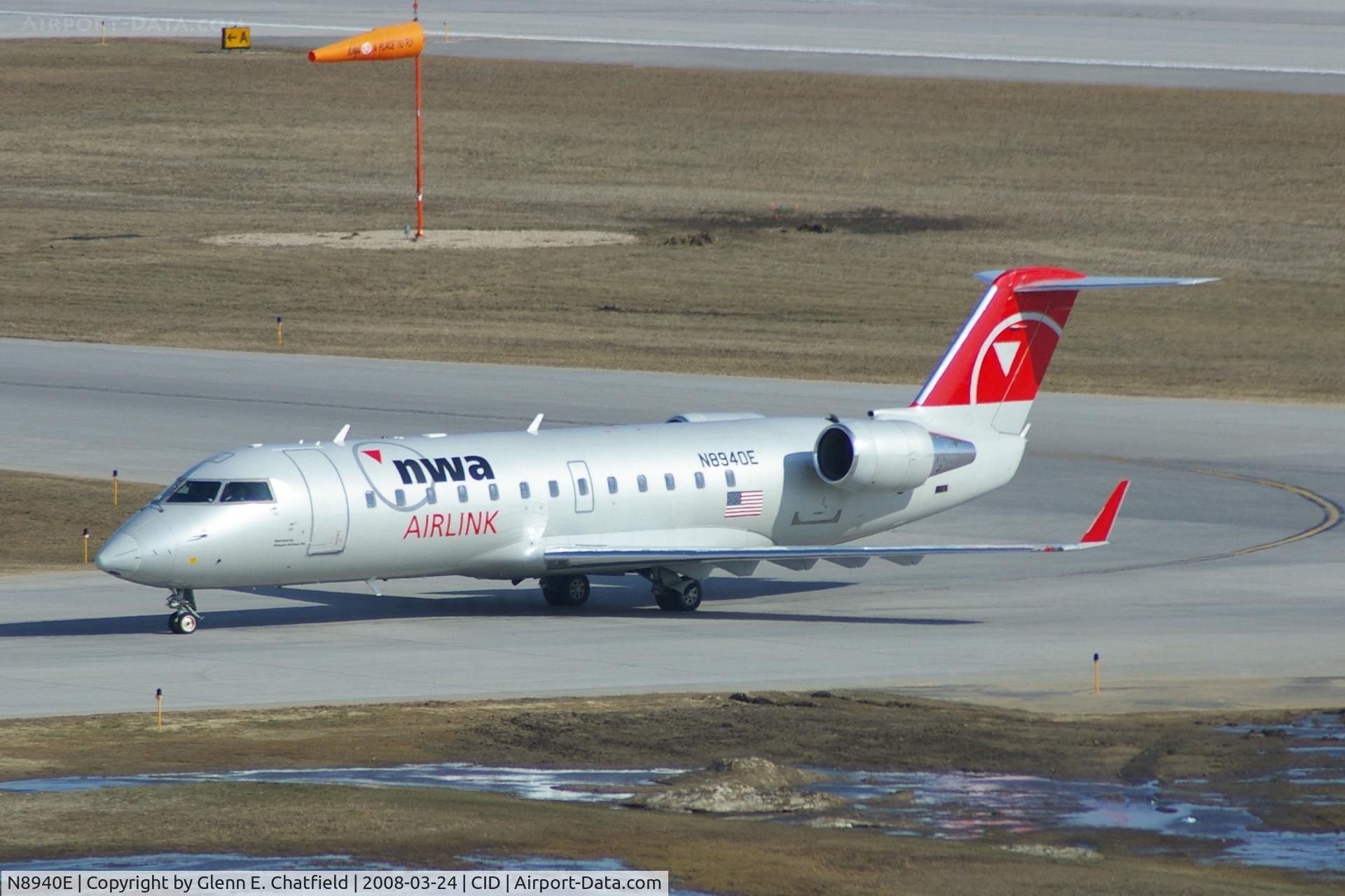 N8940E, 2004 Bombardier CRJ-200 (CL-600-2B19) C/N 7940, Taxiing off Runway 13 to the gate