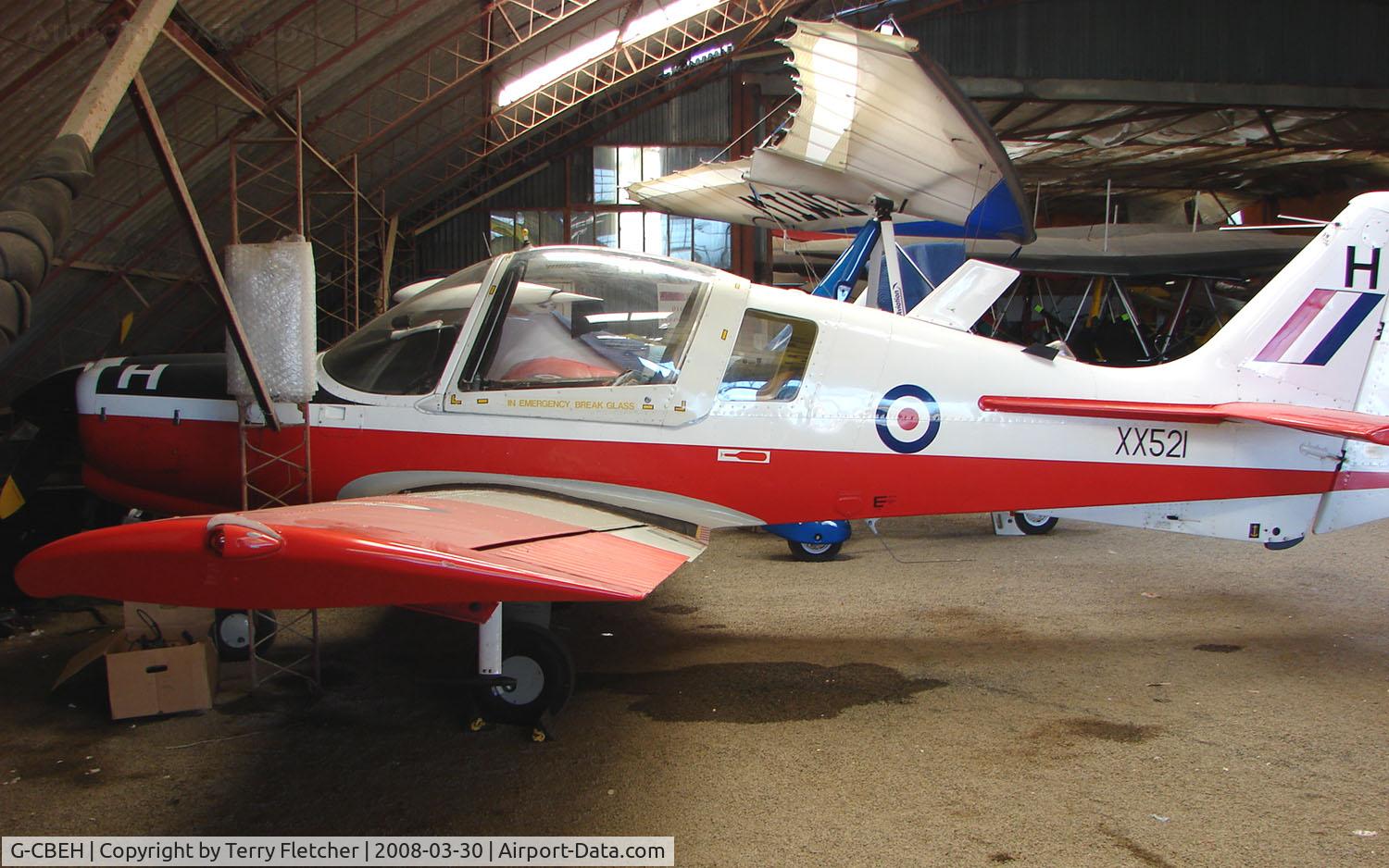 G-CBEH, 1973 Scottish Aviation Bulldog T.1 C/N BH120/207, Hangared at Enstone UK this Bulldog still wears its XX521 Serial and colours