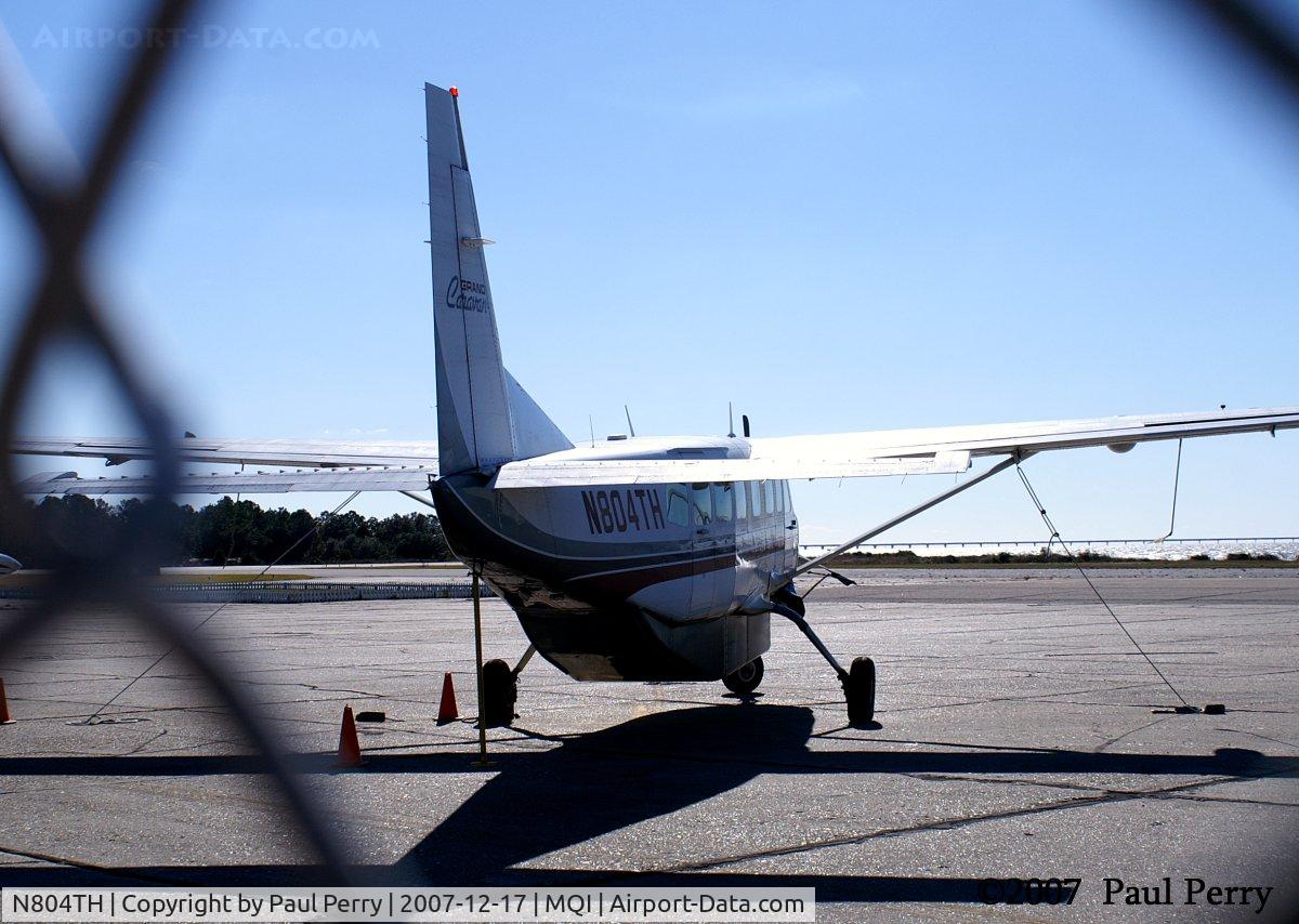 N804TH, 1994 Cessna 208B Grand Caravan C/N 208B0421, Over the shoulder through the fence