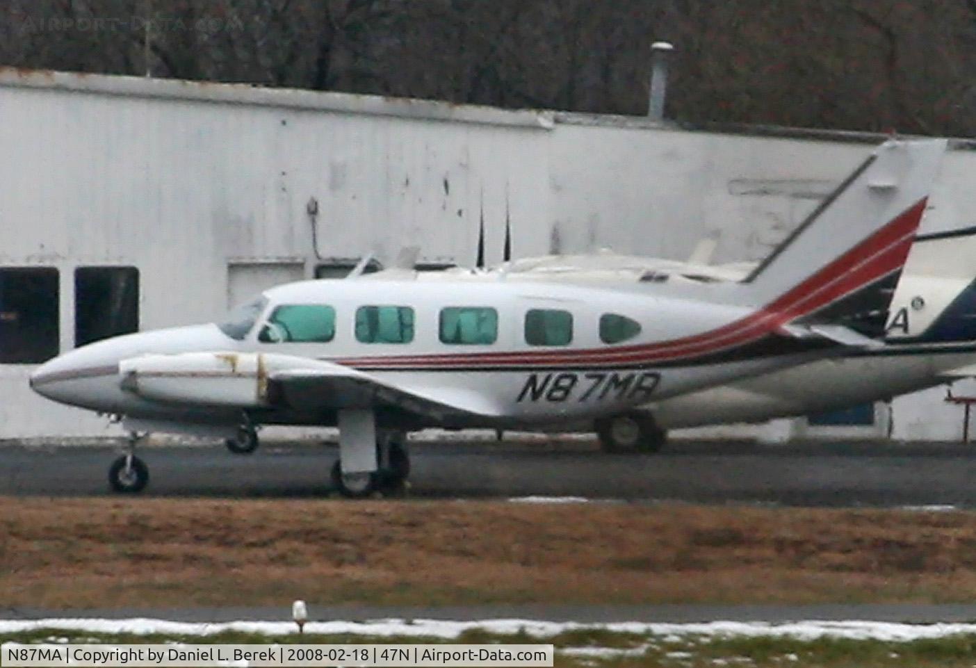 N87MA, 1969 Piper PA-31-310 Navajo C/N 31-444, Seen from an adjacent cemetary, this 1969 Navajo does not appear to have flown for a while.