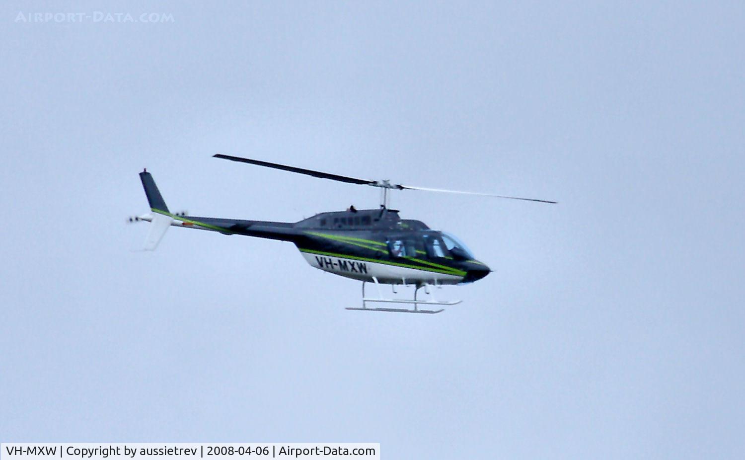 VH-MXW, 1974 Bell 206B JetRanger II C/N 1198, This copter did a low high speed loop around the hill behind my house. No idea what it was up to.