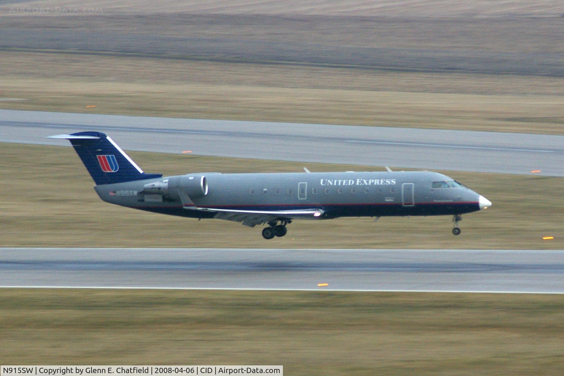 N915SW, 2002 Bombardier CRJ-200LR (CL-600-2B19) C/N 7615, Arriving Runway 27, the camera was there.  ISO 800 and right about sunset under clouds.