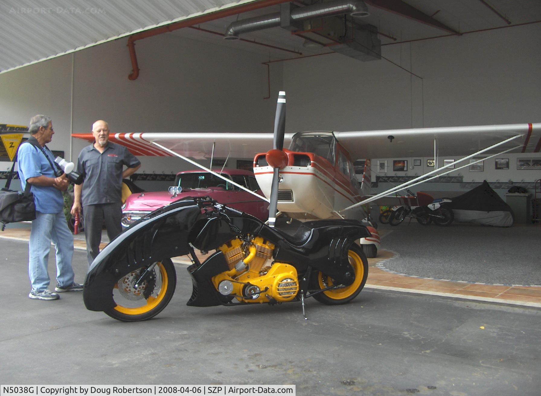 N5038G, 1979 Bellanca 7GCAA C/N 377-79, 1979 Bellanca 7GCAA CITABRIA, Lycoming O-320 150 Hp, 'ZYBORG' one-off racing bike in foreground with designer/owner