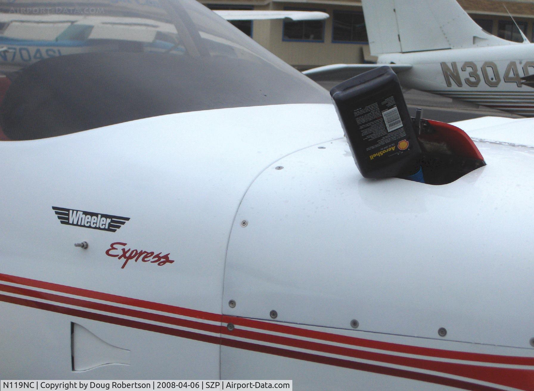 N119NC, 1991 Wheeler Express C/N 1119, 1991 Warner/Warner WHEELER EXPRESS FT, Lycoming IO-360 A&C 180 Hp, rare experimental, topping off engine oil, note: NACA duct below aircraft logo